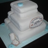 Spa Towels 3 tier lemon swirl cake with lemon curd/lemon cream cheese filling for a spa's grand opening.