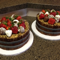 Barrel Cakes With Fresh Strawberries (Some Dipped In Chocolate) The barrel of the cakes were made with white Kit Kats that I turned around backwards and then painted brown to look like wood. Gray fondant...
