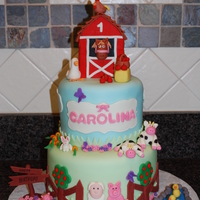 Farm Birthday Cake covered in fondant with fondant animals.