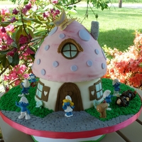 The Smurf House. Smurfette stand on her door step. Grumpy hovers over a tied up Garagamel, with Brainy Smurf. Azrael sneaks around to help Gargamel. Wash is...