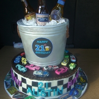 Race Car And Beer Bottles Twenty-first birthday for a young man who's hobby is Race Car driving. Everything is edible with the exception of the cake board. The...