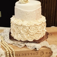 Lacy Wedding Cake I used patchwork cutters to get the lace look on the top tier. Rose on top is a gumpaste/fondant mix.