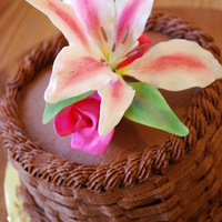 Grandma's Birthday A birthday cake for a friend's grandma. Her favorite flower is the stargazer lily. I added a couple of roses for accent.