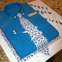 Shirt And Tie Cake For Co Workers 80Th Birthday Wasc Cake With Buttercream Filling Fondant Tie Covered With Edible Paper Design Shirt and tie cake for co-workers 80th birthday. WASC cake with buttercream filling. Fondant tie covered with edible paper design.
