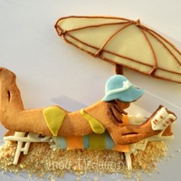 Tropical Girl Scene consists of three separate cookies. One for the beach recliner with towel, one for the girl and one for the umbrella.