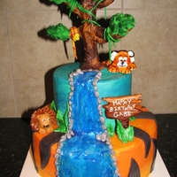 Jungle Safari Cake All edible. Buttercream with fondant accents and fondant tree hand painted.