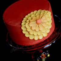 Thanksgiving Flower I made this cake for a Thanksgiving potluck. Vanilla cake with caramel filling and almond buttercream. I piped the flower using the petal...