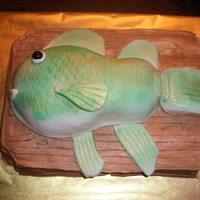 Fish Cake Carrot Cake with cream cheese icing for the board. RKT for the fish body covered with homemade fondant. Should have done something...