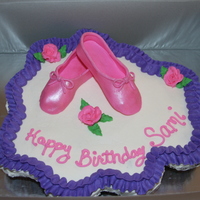 Ballerina Cupcakes chocolate cupcakes with vanilla buttercream made into a "cake". the flowers are bc and the ballet slippers are fondant with disco...