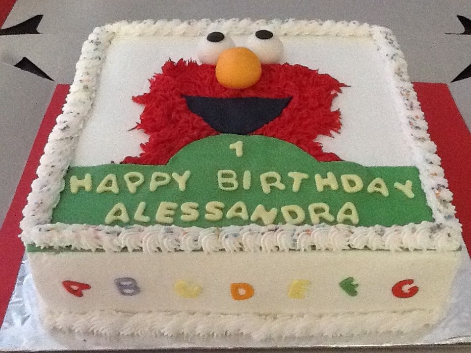 Elmostrawberry With Strawberry Buttercream Filling Covered In Vanilla Buttercream Elmo...strawberry with strawberry buttercream filling. Covered in vanilla buttercream.