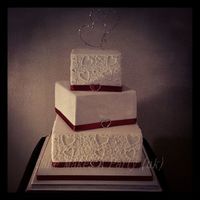 Piped Wedding Cake To Match Invites Bottom Tier Red Velvet Cake With White Chocolate Ganache Middle Tier Vanilla Cake With Milk Chocolate... Piped wedding cake to match invitesBottom tier red velvet cake with white chocolate ganacheMiddle tier vanilla cake with milk chocolate...