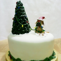 Great Dane And Tree Made for my husband's Christmas party. Dog made out of fondant. Tree made out of fondant and royal icing.