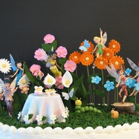 Tink & Faries Flowers, table, tree stump, snail and worm are fondant/gumpaste, faries are plastic figures.
