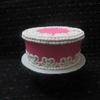 Celebration Cake a celebration cake for a friend of mine. buttercreamwith fondant pearls and lace cut outs.