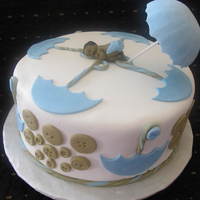 Cute As A Button Baby shower cake with umbrellas and buttons. Was a last minute request from a friend of mine and since I had the baby mold I figured I...