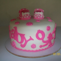 Baby Girl Double chocolate cake with butter almond filling. Shoes made with fondant strengthened with Tylose.