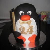 Penguin Cake Penguin cake made for a woman's boyfriend on his "golden" birthday. He loved Penguins and Hockey...thus the Penguin with a...