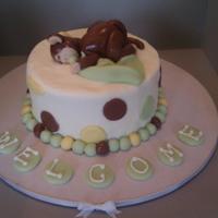 Sleeping Baby Monkey Small Baby Monkey cake for Mom and Dad to be. There were cupcakes that went along for the baby shower.