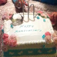 Mom And Dad's 60Th Anniversary Cake Frosted with Whip-N- Ice. Fondant/gumpaste carnations, letters and butterflies and cut-out.