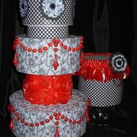 Black & Red Wedding Cakes Isomalt Ruffle Roses hand pulled on the large cake and isomalt pleated fabric on the smaller with Icing Images and cut with the Sweet...