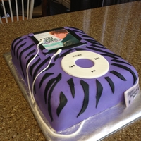Justin Bieber Ipod Cake 11 x 14 vanilla cake filled with buttercream. Covered with fondant. JB's pic is an edible image. Earphones are made of fondant.