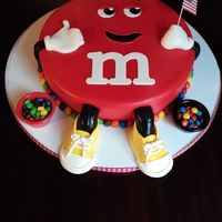 M&m Cake This is for my daughter's 22nd birthday. She wears converse all the time so I gave him yellow converse instead of white shoes. The...