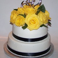 Fresh Rose Anniversary Cake 10in 8in stacked - iced in buttercream with navy satin ribbon and fresh yellow roses - this was my first time using fresh flowers - thanks...