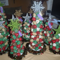 Christmas Cake Ball Trees! These are just a FEW! I actually took 24 orders this year for these, they are a BIG hit! Basically just a cone covered in specialty...