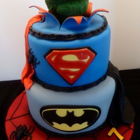 Superheros Cake A 7th birthday cake made for the son of a friend. The cakes were 9" and 7" rounds, covered with MFF. All decorations were...
