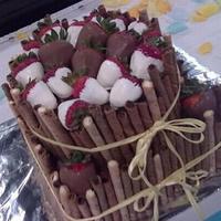 Chocolate Covered Strawberry Grooms Cake This is a chocolate cake with chocolate filling and icing. I used Pirouette cookies to make a basket look for both tiers. Then they were...