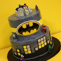 Batman Themed Cake Dark chocolate cake with a cookies and cream IMBC filling on the bottom, topped with white velvet and cheesecake IMBC filling. Buttercream...