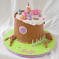 Anjo's Forest Tea Party Cake Fondant tea set toppers with extended tier tree stump cake covered in fondant.