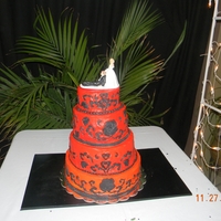 First Wedding Cake white cake buttercream frosting fondant accents red orange color
