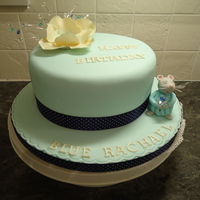 Birthday Cake For 'the Blue Rachael' 8 inche round chocolate cake with Tiffany Blue fondant, a fantasy flower made from flower (gum) paste.....and......my Granddaughter calls...