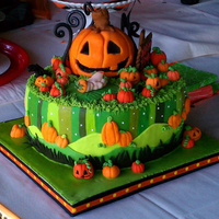 Halloween Themed Baby Shower Design was inspired by a tissue box. Most decorations were made with MMF and royal icing. The large jack o' lantern was made from RKT...