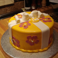 Hawaiian Birthday Cake Used my Cricut Cake to cut out the Hibiscus flowers. Used airbrush to mist with pearl sheen.