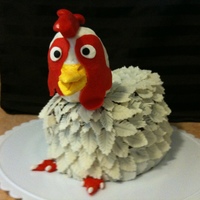 Chocolate Chicken Little chocolate chicken for my egg farmer friend. Chocolate cake covered in white modeling chocolate feathers - all cut out and veined one...