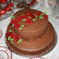 Chocolate Cake With Chocolate Icing Anniversary cake for chocolate lovers. Chocolate cake with chocolate butter cream icing. The cupcakes are carrot cake and red velvet cake...