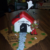 Scooby Doo & Shaggy Dog House Birthday Cake I made this cake for my Daughter's Bday. Cake is iced in buttercream accents are made out of fondant. Made Shaggy and Scooby figures...