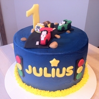 Gumpaste Car & Truck Toppers On Cake Smash cake for little boy. Iced with buttercream and decorations are made of fondant/gumpaste.