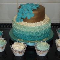 Butter Icing Ruffle Cake And Cupcakes Bottom tier - Raspberry and white chocolate with hand piped butter icing ruffles. top tier chocolate covered in chocolate fondant. cupcakes...