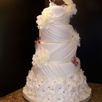 Wedding Cake This wedding cake was done like the cake in the wilton cake magazine but I added a few additions