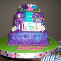 Purple Gift purple two tier cake first time stacking. my little customer asked that it be purple, sparkly and gurly with flower's. She turned the...