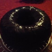 Chocolate Cream Filled Donut A dark chocolate espresso donut cake filled with a marshmallow cream topped with a dark chocolate gnache