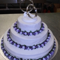Lavender/purple Rose Wedding Cake This is the first wedding cake I have ever made. The icing isn't perfect but everyone loved and and said it tasted great! This cake is...