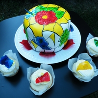 Tammy & Terry's Stained Glass Cake WASC cake decorated with gelatin features and then hand painted. Accompaning cupcakes have homemade hard candy broken into pieces...