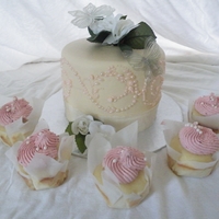 Duane & Jenilee WASC cake with strawberry filling and cupcakes are also WASC with strawberry buttercream. Gelatin butterflies with silk flowers.