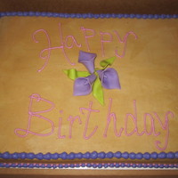 Half Sheet Cake Covered In Peanut Butter Buttercream With Fondant Lillies And Leaves Half sheet cake covered in peanut butter buttercream with fondant lillies and leaves.