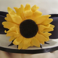 Sunflower Cake With Bow 10' vanilla cake with chcolate buttercream. Cake was for a Stag and Doe, colours and sunflower made match wedding theme.