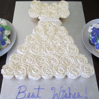 Cupcake Wedding Dress Cupcake Wedding dress with cupcake floral bouquetsDress is made up for 31 regular cupcakes on a 18 x 26" boardBouquets have 9 cupcakes...